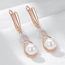 Brincos Longos de Pérola com Ouro Rosa 585 e Zircônia
